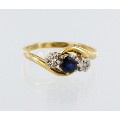 142 - 18ct yellow gold sapphire and diamond crossover style ring, one round sapphire and two brilliant cut... 