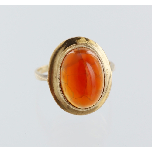 160 - 9ct yellow gold carnelian ring, oval cabochon 15mm x 10mm, finger size P, weight 4.7g