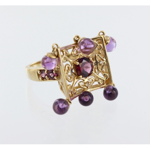 181 - Yellow metal (stamped 9ct) square multi gemstone filigree head ring, six amethyst beads, five almand... 