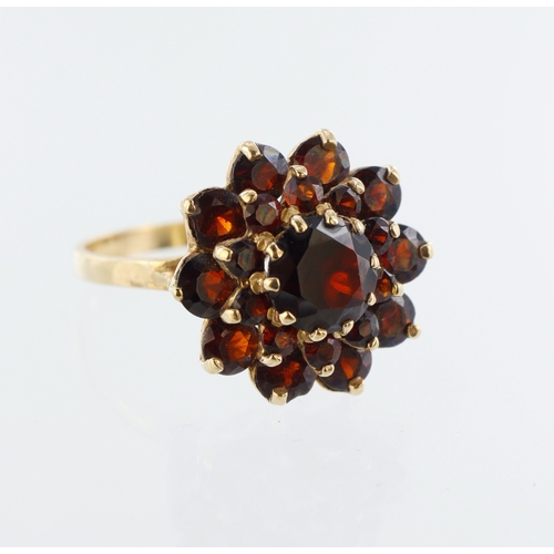 19 - 9ct yellow gold garnet cluster ring, twenty one round garnets in three tiers, finger size T/U, weigh... 