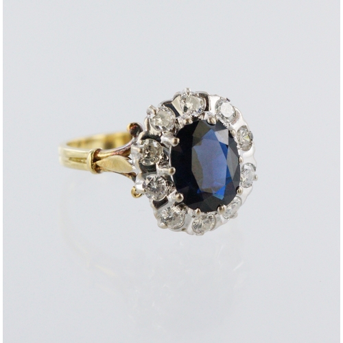 198 - 18ct yellow gold sapphire and diamond cluster ring, oval sapphire 10mm x 8mm, ten round brilliant cu... 