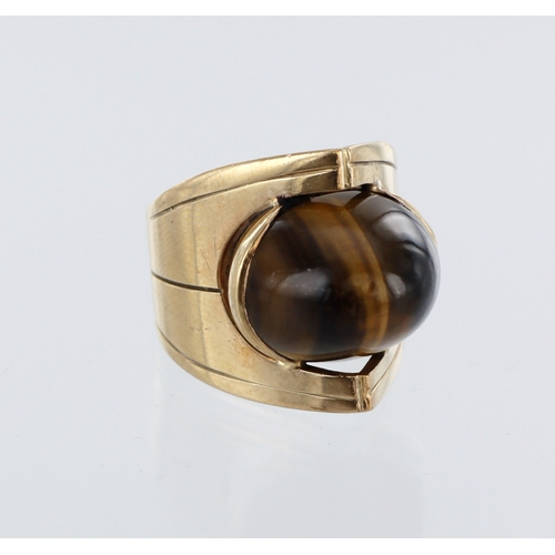 22 - 9ct yellow gold dress ring, single high tigers eye cabochon, finger size N, weight 8.5g