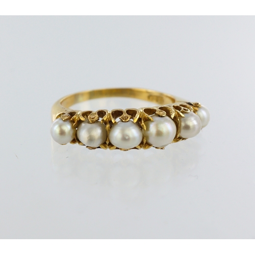 231 - Yellow metal (stamped18ct) pearl ring, sixgraduated pearls, finger size P, weight 6.0g