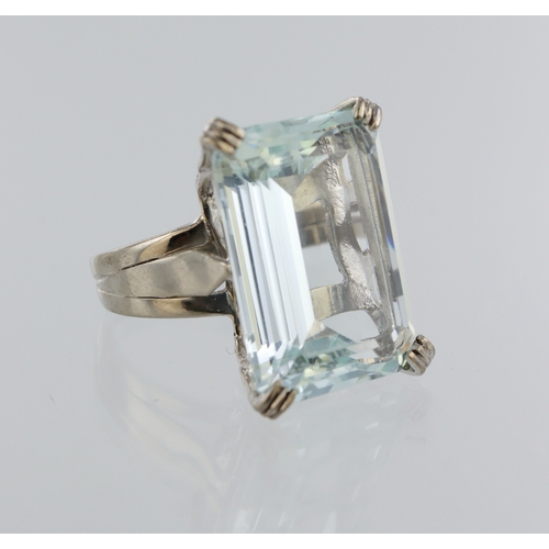 24 - White metal (stamped 18ct) dress ring, single step cut aquamarine measuring approx. 20mm x 15mm, fin... 