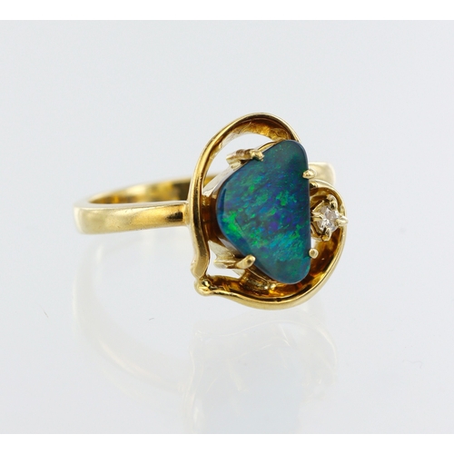 255 - Stamped 18ct yellow gold boulder opal ring, abstract design with diamond accent, total diamond weigh... 