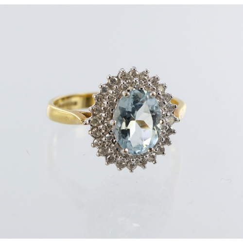 32 - 18ct yellow gold aquamarine and diamond cluster dress ring, total diamond weight approx. 0.15ct, fin... 