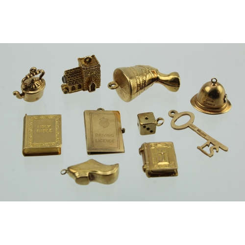 339 - Ten 9ct/tests 9ct charms. Total weight 15.9g