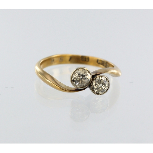 39 - Yellow metal (tests 18ct) diamond crossover ring, two round old cuts, total diamond weight approx. 0... 