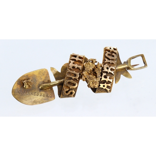 422 - Yellow gold (tests approx 18ct) South African goldfields brooch in the form of a shovel, set with tw... 