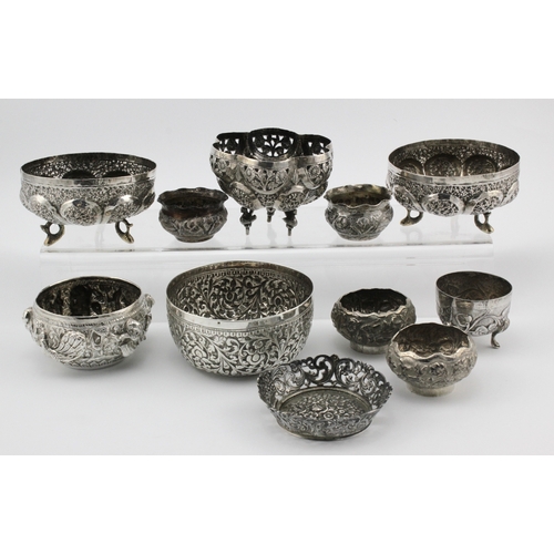 564 - White Metal. Eleven mostly white metal ornately decorated bowls (possibly Indian), largest diameter ... 