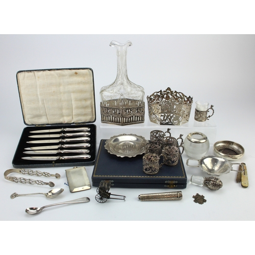 584 - Mixed Silver. A collection of various silver items, including spoons, tongs, cheroot holder, etc., s... 