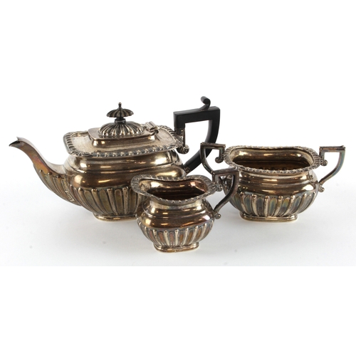 586 - Silver three piece tea set, comprising teapot, milk jug & sugar bowl, hallmarked 'H.W. Ld, Birmingha... 