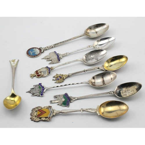 604 - Enamel Teaspoons. Eight silver & enamel souvenir teaspoons, all relating to UK destinations, includi... 