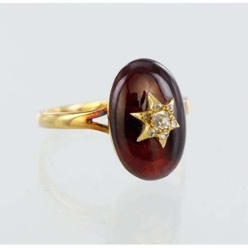 66 - Yellow metal (tests 18ct) garnet and diamond dress ring, oval garnet cabochon measuring approx. 15mm... 