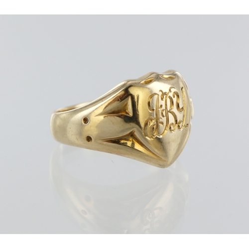 69 - Yellow metal (stamped 14ct) shield shaped signet ring, finger size N, weight 8.0g