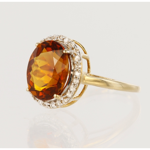 70 - 14ct yellow gold cluster ring set with central brown topaz measuring approx. 12mm x 10mm, surrounded... 