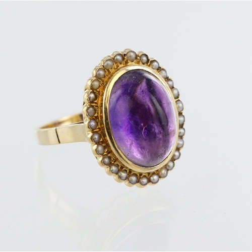 80 - Yellow metal (stamped 18ct) amethyst and pearl cluster ring, amethyst cabochon 15mm x 10mm, twenty e... 