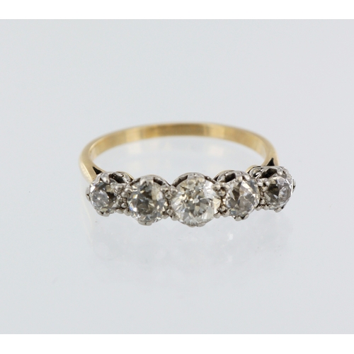 84 - Yellow metal (tests 18ct) diamond half eternity ring, five graduated round old cuts, total diamond w... 