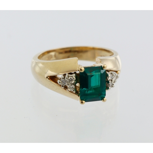 89 - 14ct yellow gold synthetic emerald and diamond ring, step cut synthetic emerald 7mm x 5mm, six round... 