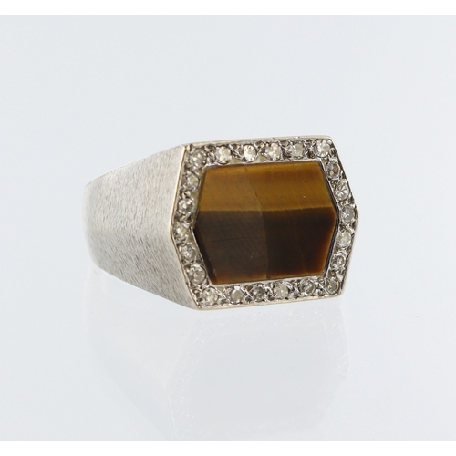 96 - White metal (stamped 18ct) hexagonal signet ring, tigers eye with twenty two round brilliant cut dia... 