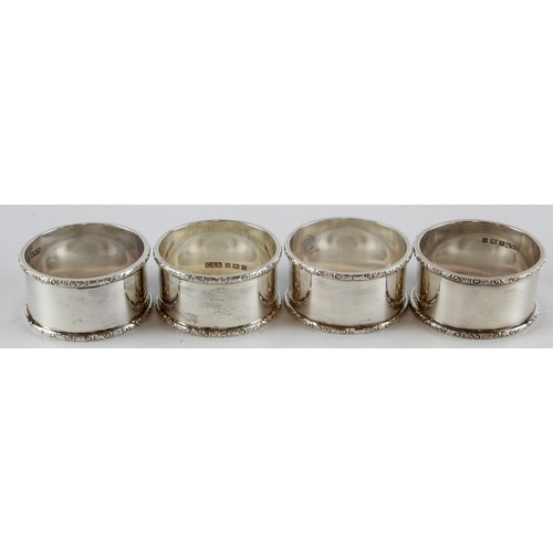 598 - Matching set of four un-initialled silver napkin rings, three hallmarked for C&N Birm. 1961 and one ... 