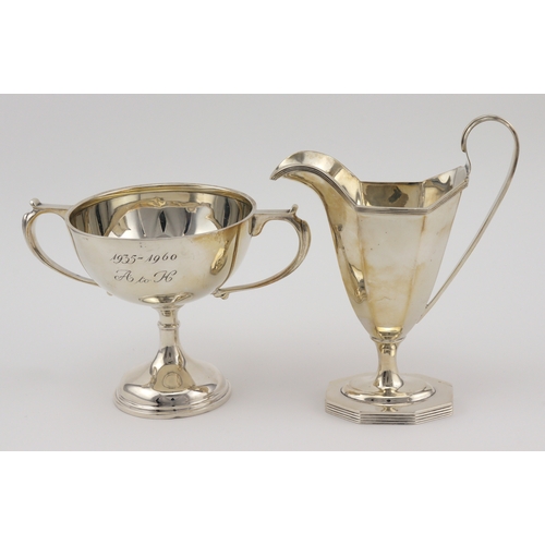 415 - Helmet shaped silver cream jug, hallmarked TB&S (Thomas Bradbury & Sons) London 1918 plus a two hand... 