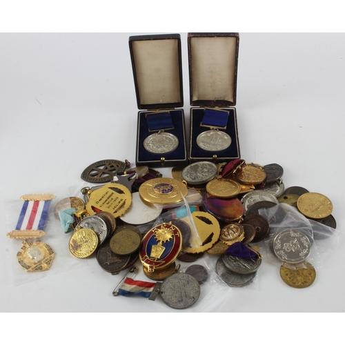 974 - Medals, society jewels, tokens etc (65) noted school medals such as white metal Eton attendance meda... 