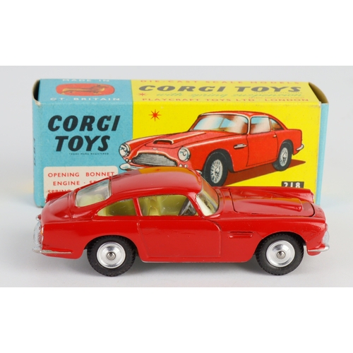 129 - Corgi Toys, no. 218 'Aston Martin D.B.4' (red), with model club slip, contained in original box