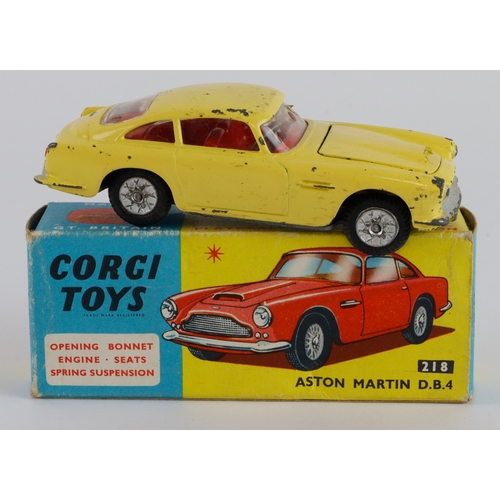 130 - Corgi Toys, no. 218 'Aston Martin DB4' (yellow), contained in original box