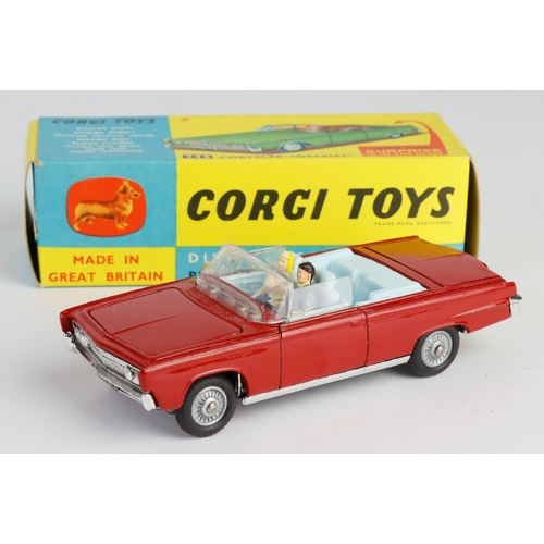 145 - Corgi Toys, no. 246 'Chrysler Imperial' (red), golf clubs present, with model club slip, contained i... 