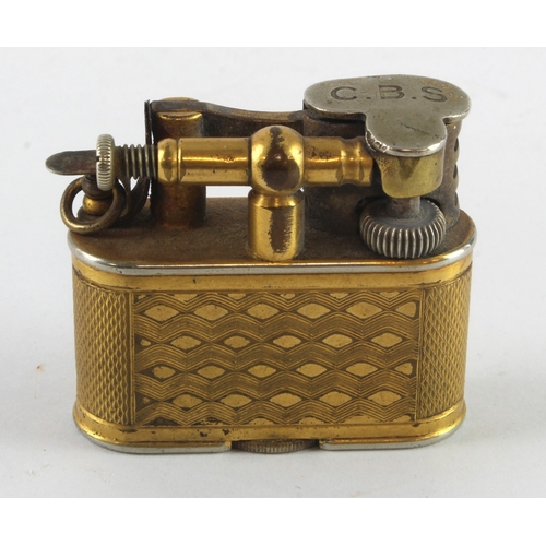 437 - Dunhill. A Dunhill gold plated engine turned lighter, made for Harrods, marks to base, height 36mm, ... 