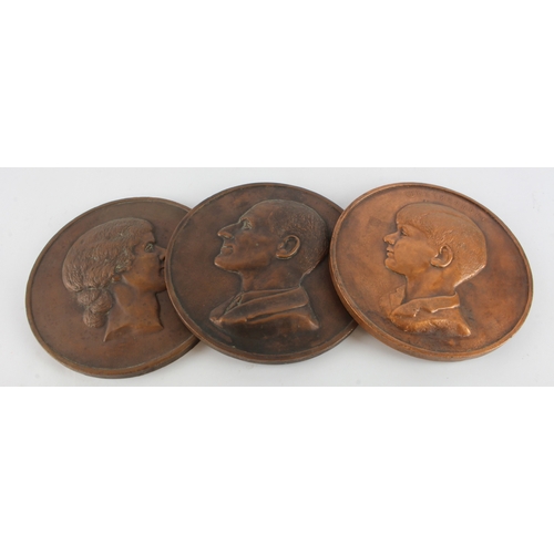 453 - Plaques. Three copper plated plaster plaques, each depicting a different portrait, comprising 'M. A.... 