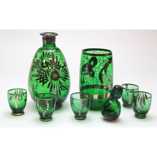 61 - Glass. A collection of green glass with floral decoration (possibly by Murano), comprising decanter ... 