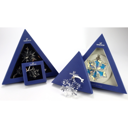 74 - Swarovski. A collection of eight boxed Swarovski crystal Christmas ornaments, largest diameter 95mm ... 