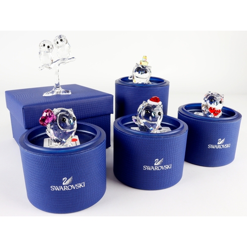 76 - Swarovski. A collection of five boxed Swarovski crystal owl ornaments, comprising Hoot (5270271, 527... 