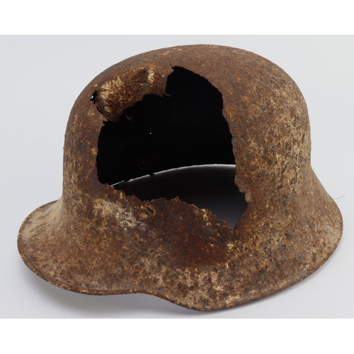 1043 - German WW1 1916 pattern steel helmet with battle damage looks like shrapnel has hit side and top hal... 