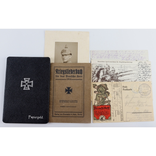 1048 - German WW1 group with Solbuch postcards, wallet, pocket book etc.