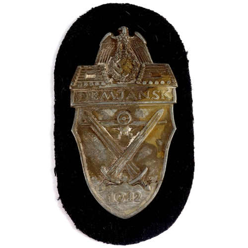 1062 - German WW2 Demjansk  arm shield unissued.