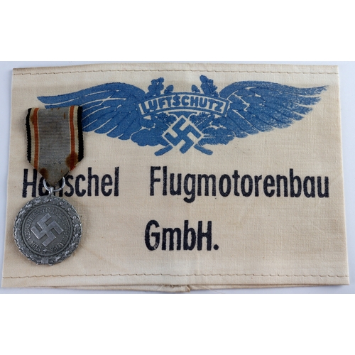 1074 - German WW2 Luftschutz Civil Defence Long Service medal with arm band.