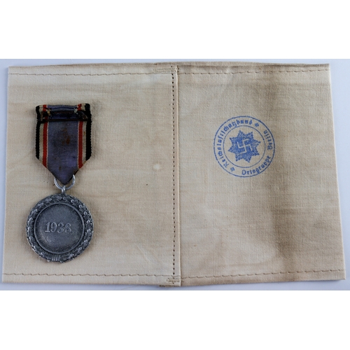 1074 - German WW2 Luftschutz Civil Defence Long Service medal with arm band.