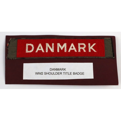 328 - DANMARK WW2 Machine woven shoulder title badge in excellent unworn condition.