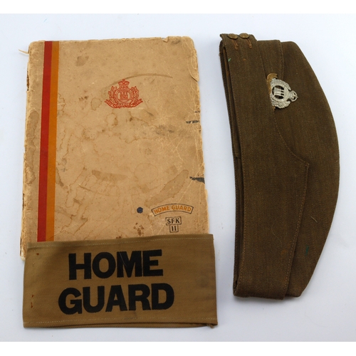 446 - Suffolk Home Guard 11th bn booklet with the owners arm band and side hat.