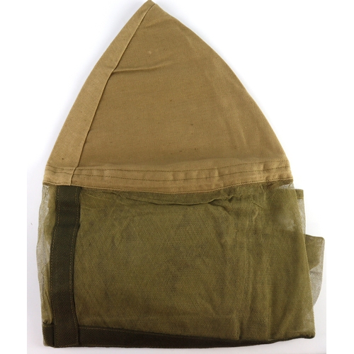 515 - WW2 1944 dated unused mosquito net for helmets.