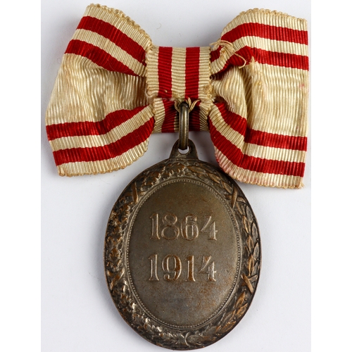 577 - Austrian Red Cross Medal, bronze and enamel with wreath, dated 1864-1914