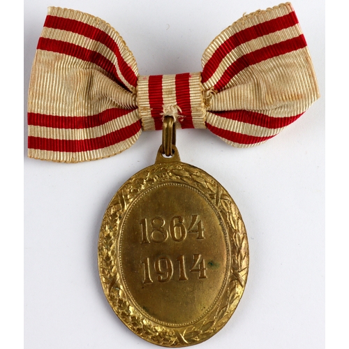 578 - Austrian Red Cross Medal, gilt bronze and enamel with wreath, dated 1864-1914