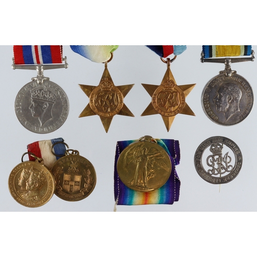 604 - BWM & Victory Medal (250944 Pte W E Hedges Essex Regt) with Silver War Badge 469506. Plus his Sons W... 