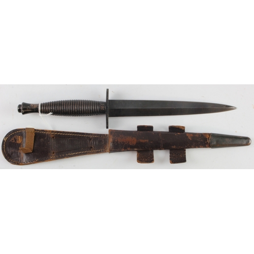 61 - FS Commando fighting knife 3rd pattern, blackened blade, complete with scabbard.