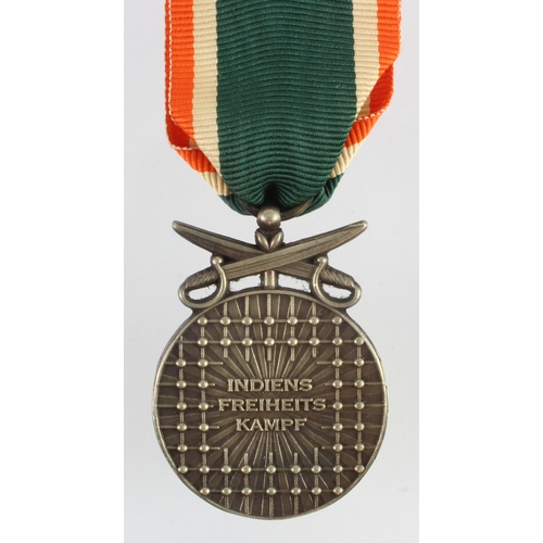 684 - German / Indian interest an Azad Hind Bravery medal with Combat swords.