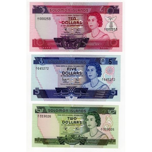 1084 - Solomon Islands (3), 10 Dollars, 5 Dollars and 2 Dollars issued 1977, first series notes with 'A/1' ... 