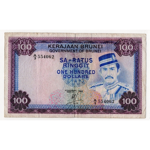 572 - Brunei 100 Ringgit dated 1980, serial A/3 554062 (BNB B110d, Pick10b) Fine+